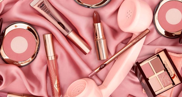 Charlotte Tillbury beauty products pink lipstick and eyeshadow